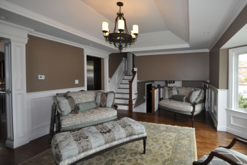 Renovated Living Room with Custom Millwork and Trayed Ceiling.